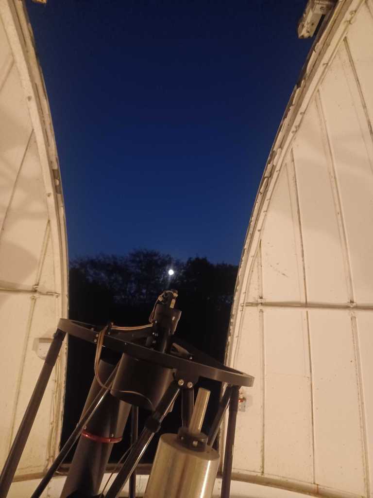 The moon over the University of Birmingham observatory at Wast Hills.